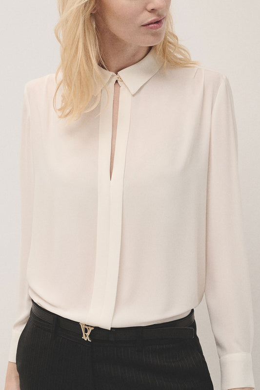 Beige blouse with front opening and pleat