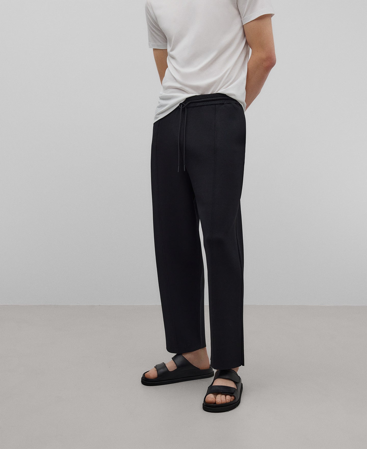 Black knit trousers man in black