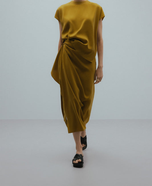 Draped skirt with knot woman in yellow turmeric