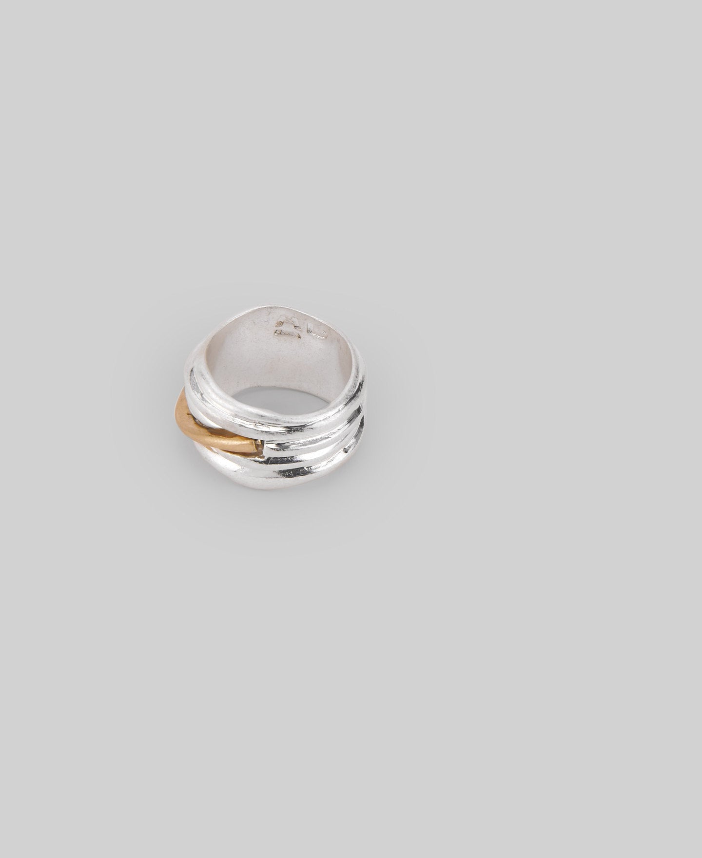 Two-tone tubular metal ring in silver/gold