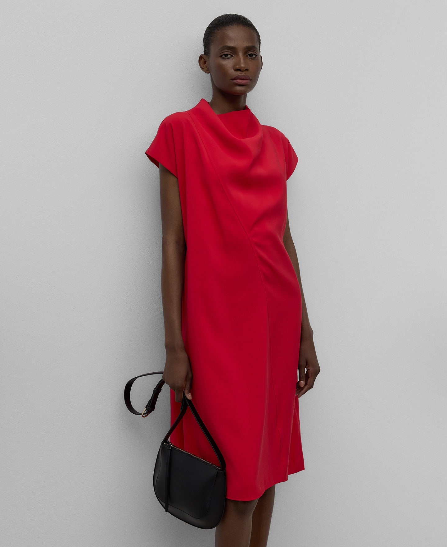 Red dress with draped neckline woman in red