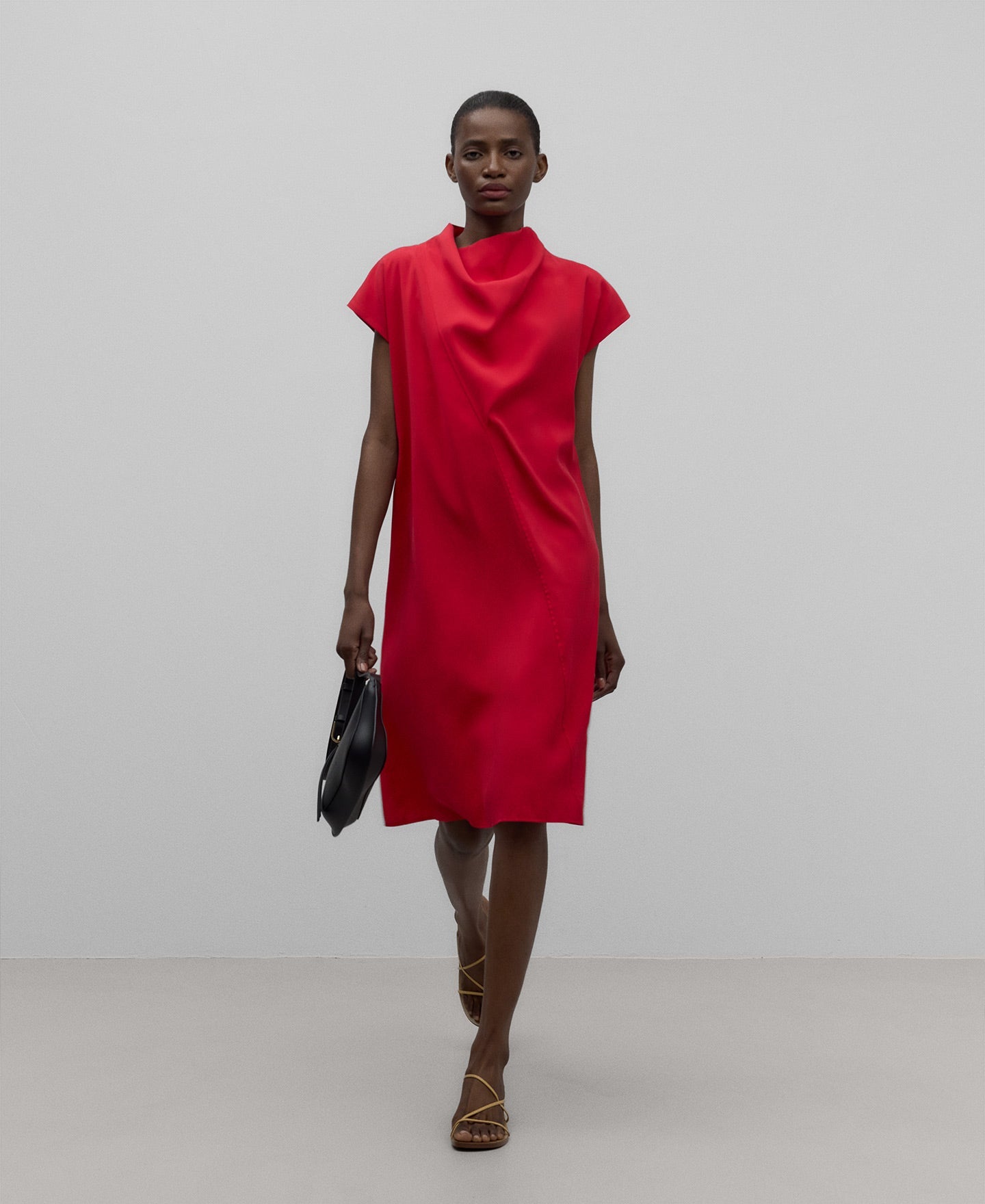 Red dress with draped neckline woman in red