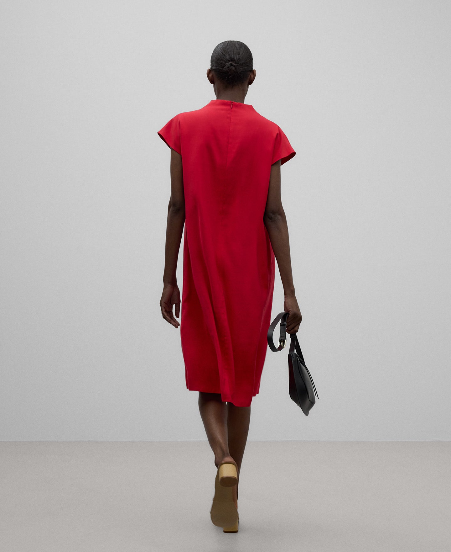 Red dress with draped neckline woman in red