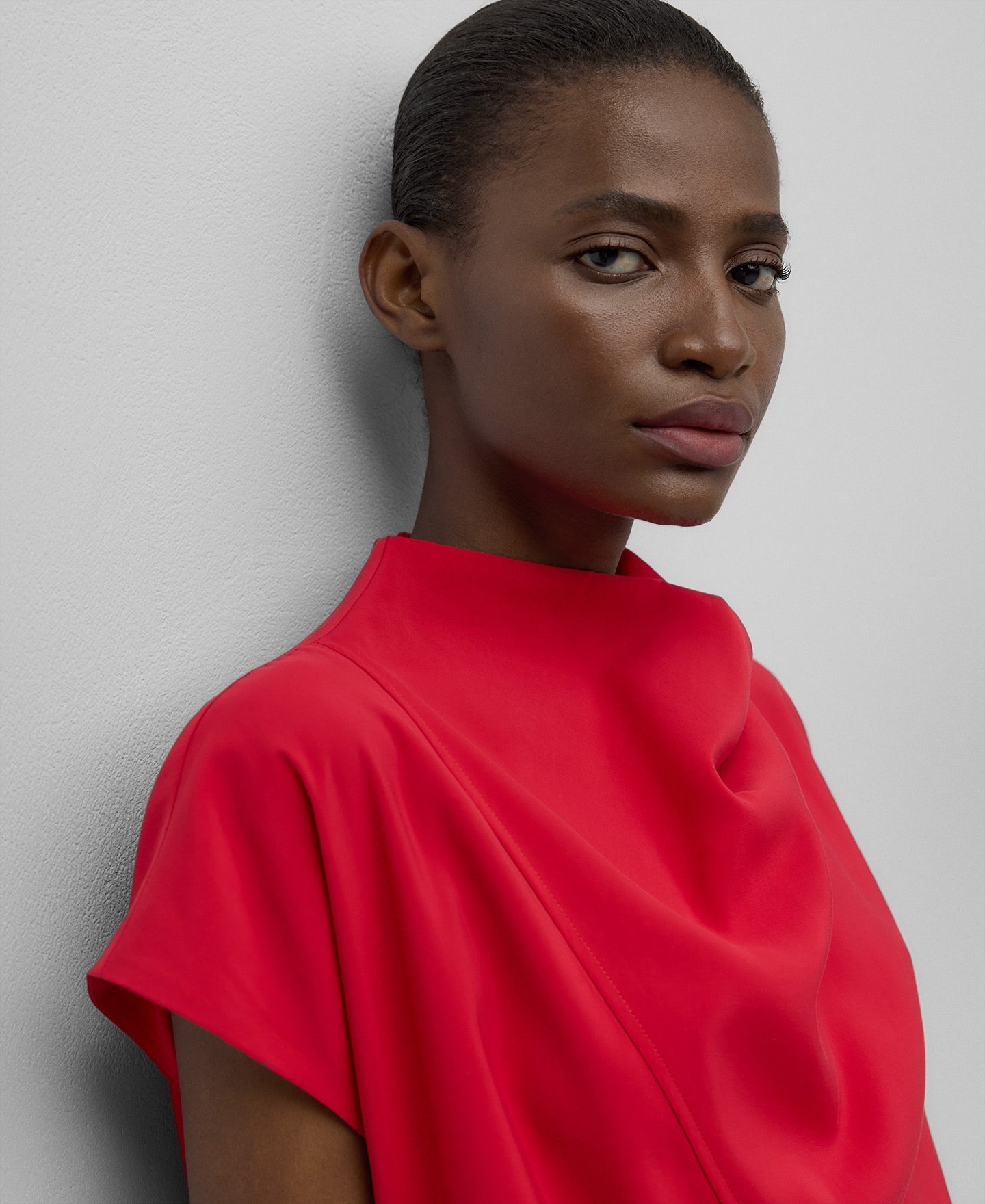 Red dress with draped neckline woman in red