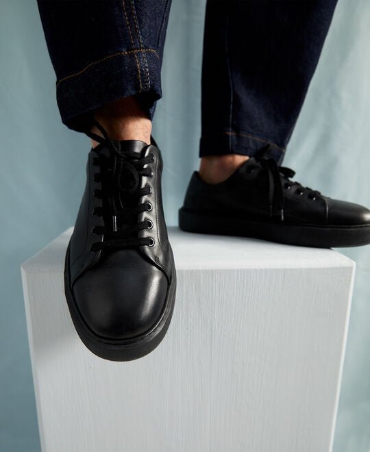 Men Shoes | Black Die-Cut Logo Sneaker by Spanish designer Adolfo Dominguez